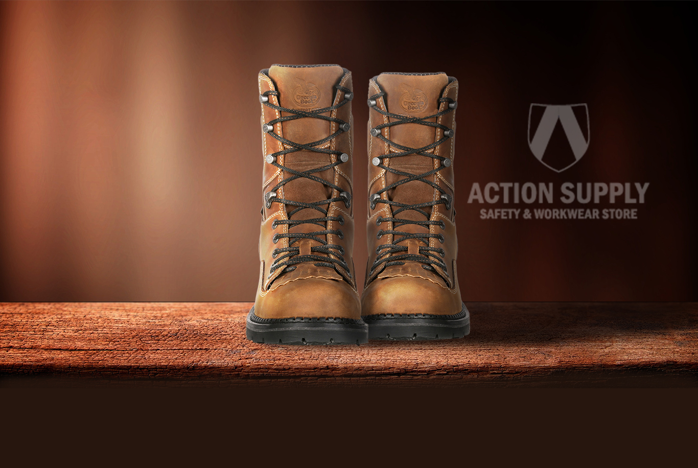 Nice pair of Georgia Boots on table with Action Supply logo in the back